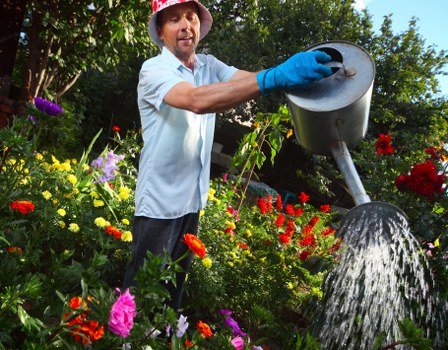 Professional gardening team following safe working practices
